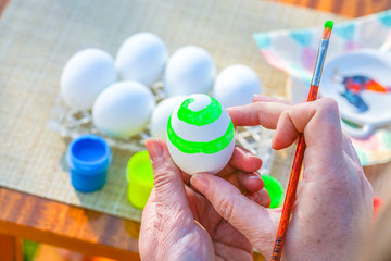 Obraz na płótnie Canvas Coloring Easter eggs