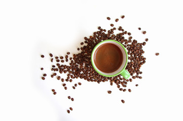 Top view of a coffee cup and coffee beans on a white background