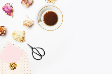 coffee and roses on the white background, top view, Flat lay