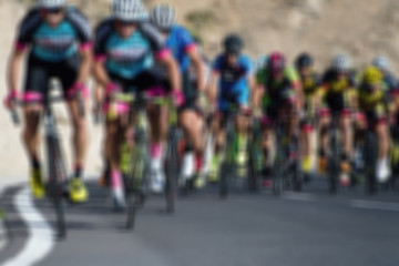 Fototapeta na wymiar Cycling competition,blur image of asphalt road and bike
