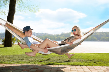 Contented couple relaxing in a hammock