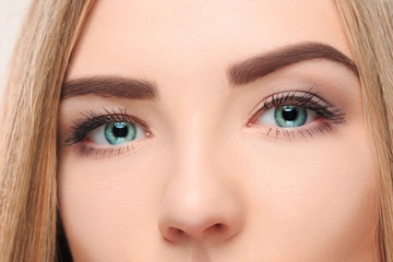 cThe lose-up face of pretty girl with beautiful big blue eyes