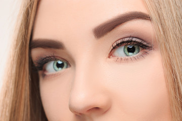 Obraz premium cThe lose-up face of pretty girl with beautiful big blue eyes