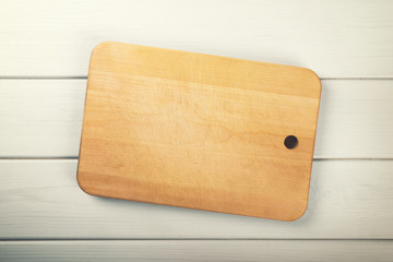 cutting board on white wooden plank background