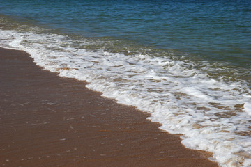 Travel to island Koh Lanta, Thailand. The view on the sea waves near to beach.