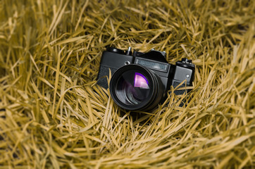 old film camera in the grass