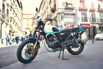 Obraz na płótnie Canvas Classic retro motorcycle on street in city