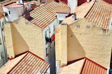 Old houses in poor quarter with tiled roofs