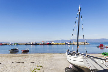 Fototapeta na wymiar Boats on Vilaxoan fishing harbor