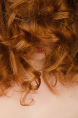Naklejka premium Beautiful long red hair on the face of woman