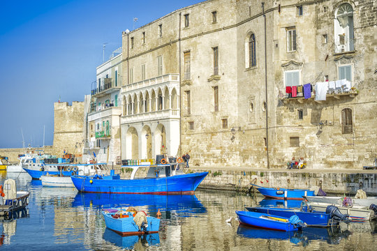 Blue boats in seaport of Monopoli, Italy