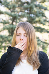 girl is very bored outdoor, the lady is not interested