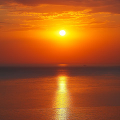 Fototapeta na wymiar Panoramic dramatic sunset sky over sea at dusk