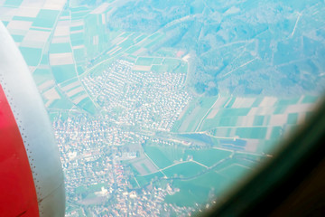Looking through window aircraft. High-angle view from airplane.