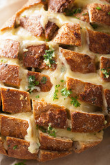 roasted party bread with melted cheese butter herbs