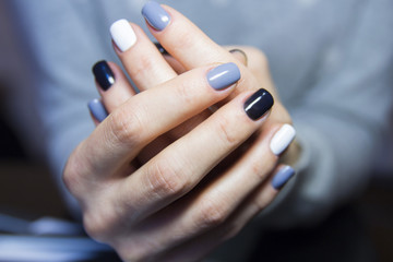 Obraz na płótnie Canvas Black, grey and white polished nails 