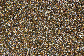Background with different color sea stones. Pebbles as a background image.