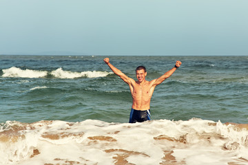 man standing in the sea