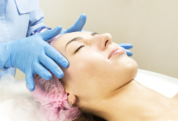 Process cosmetic mask of massage and facials in beauty salon 