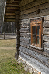 Fototapeta na wymiar Window in old wooden rural house