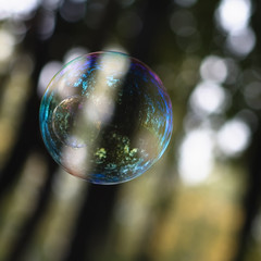 A beautiful soap bubble with reflections and overflows.