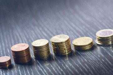 Euro money. Coins are isolated on a dark background. Currency of Europe. Balance of money. Building from coins. Coins of different values