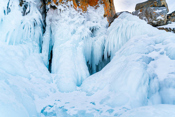 Fototapeta na wymiar Beautiful icicles and snow at rocky island