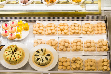 assorted of pastry in bakery window display
