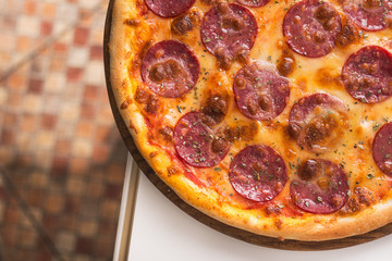 salami pizza on table