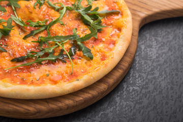 pizza with green fresh arugula