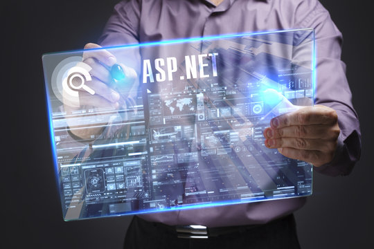 Business, Technology, Internet and network concept. Young businessman working on a virtual screen of the future and sees the inscription: ASP.NET