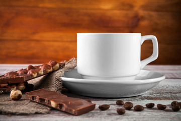 coffee chocolate cinnamon on a wooden background