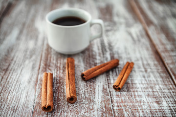 coffee chocolate cinnamon on a wooden background