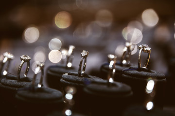 A lot of rings in window display with beautiful bokeh in vintage color