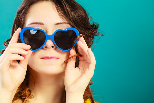 Girl in blue sunglasses portrait