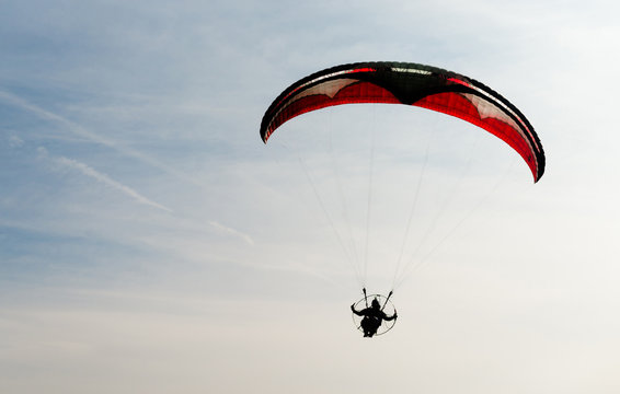 One Man Rides Flies Ultralight Flying Through Blue Sky
