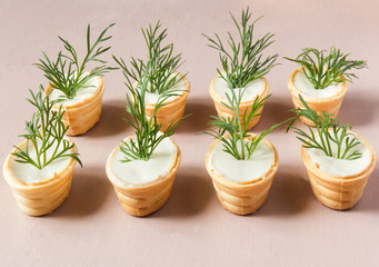 Tartlets with cream cheese and dill.