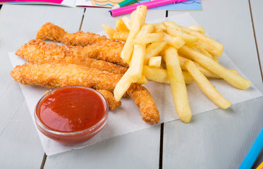 Fried chicken nuggets and french fries