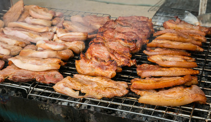 Street food in Thailand. Sales of pork, grilled or BBQ grill with charcoal. Shops in this style very popular with tourists and Thailand people.This store can be seen everywhere in Thailand.