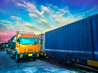 Fototapeta na wymiar The Truck is waiting for pick up container from platform of train to customer