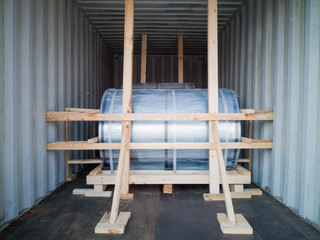 Steels are lashing and chocking into container , before being exported to overseas customers.