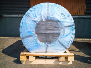 Steel coil is wrapped on pallets before being sent to the plant.