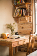 Desk in cabin with open book
