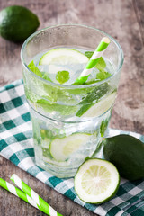 Mojito cocktail in glass on wooden background
