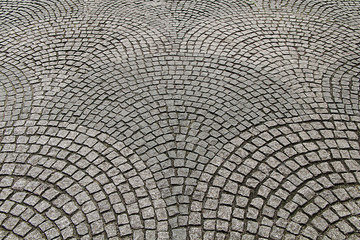 Texture of the paving stone in the form of cubes lined with circles