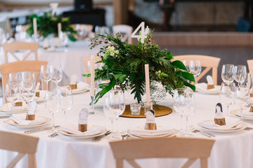 Guest table, with bouquet from petals and a number