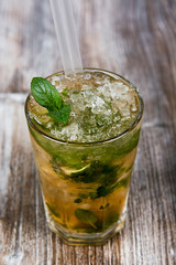 Mojito cocktail on wood background