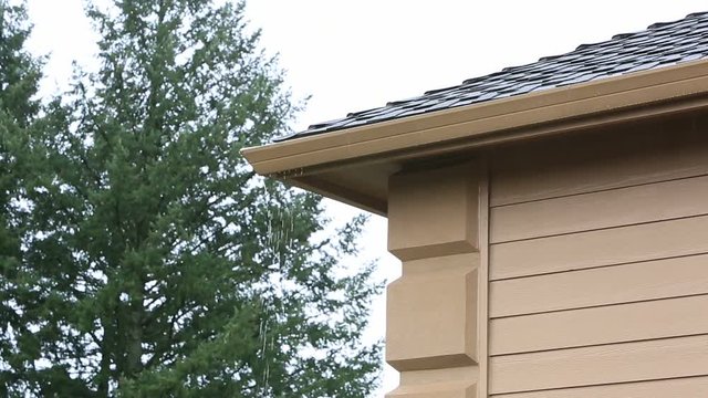 High definition 1080p video of plugged up gutter leaking on roof of a house after heavy rain with audio sound 1920x1080 hd