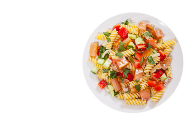 pasta salad with smoked salmon and vegetables. top view. isolated on white