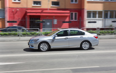Fototapeta na wymiar car moves on city street